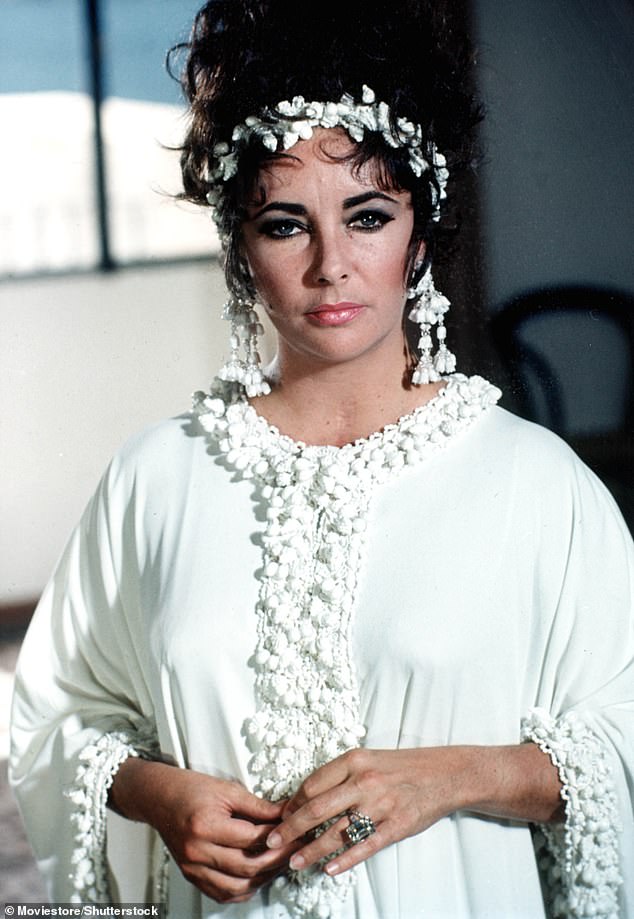 Liz: Tiziani's ivory jersey kaftan-inspired jumpsuit was designed by Karl Lagerfeld in her role as “Sissy Goforth” in the film Boom!  from 1968. starring Richard Burton