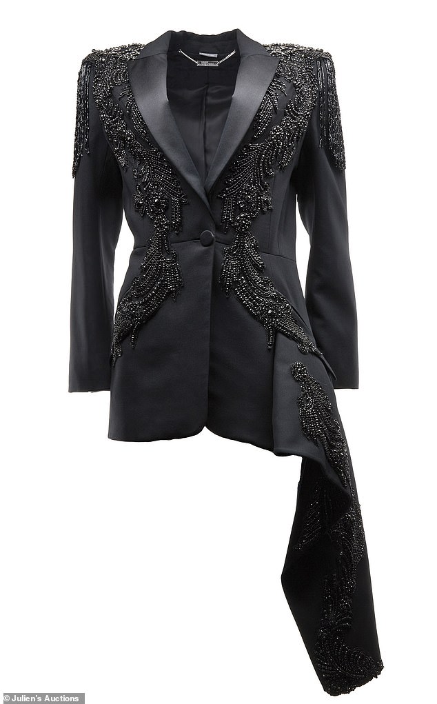 Joan: Also up for bid is Alexander McQueen's 2018 jeweled asymmetric peplum blazer