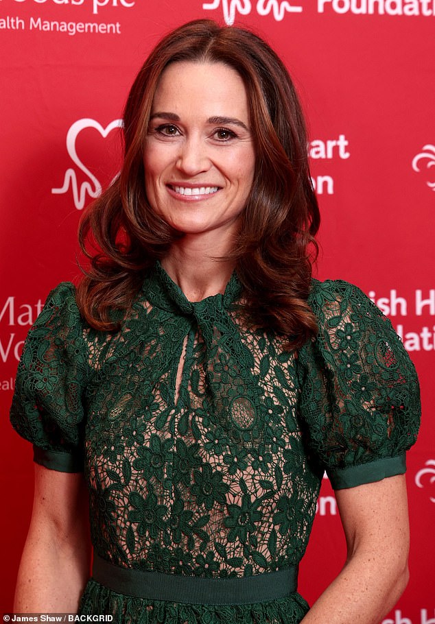 Pippa dressed appropriately for the holidays, adding a pop of red to her green ensemble