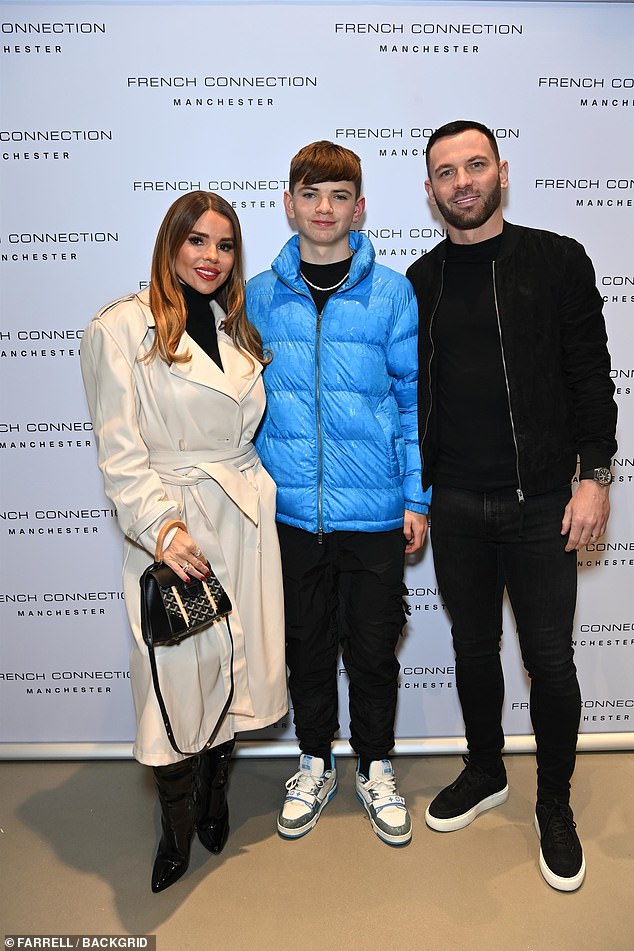 Family: Together with their eldest son Rocco, Tanya beamed as she looked glamorous in a trench coat and sleek black ensemble, while Phil looked handsome in a bomber jacket