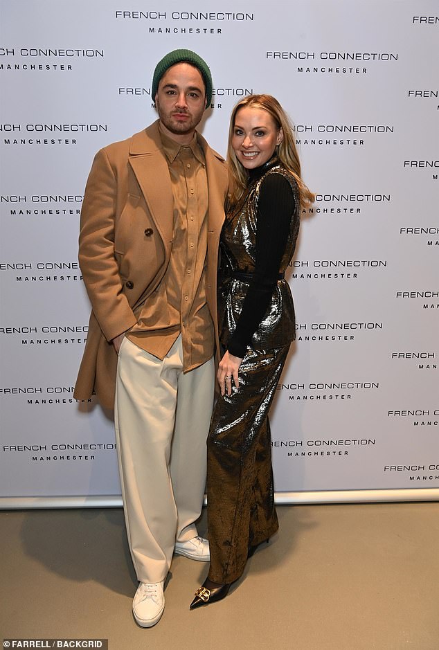 Sleek: Adam and Caroline looked glamorous for the event