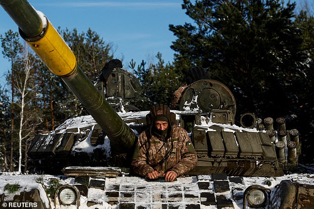 A Ukrainian soldier sits in a tank during anti-sabotage exercises, amid the Russian attack on Ukraine, in the Chernihiv region, Ukraine, December 5, 2023