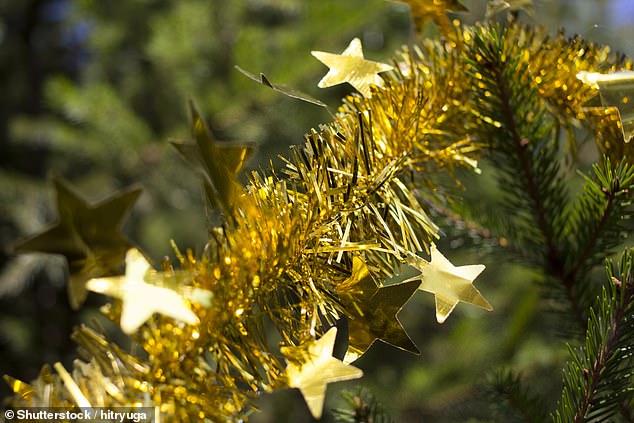 According to Uswitch, classic Christmas decorations including fairy lights, tinsel, and even the tree itself can affect your broadband speeds (stock image)