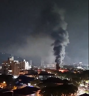 Smoke was seen billowing into the sky after supporters rioted