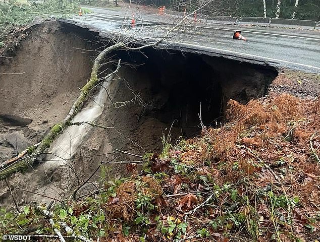 Highway 503 in Washington state was closed in both directions due to a landslide.  The flooding tore away a large section of pavement, creating a hollow space under the road