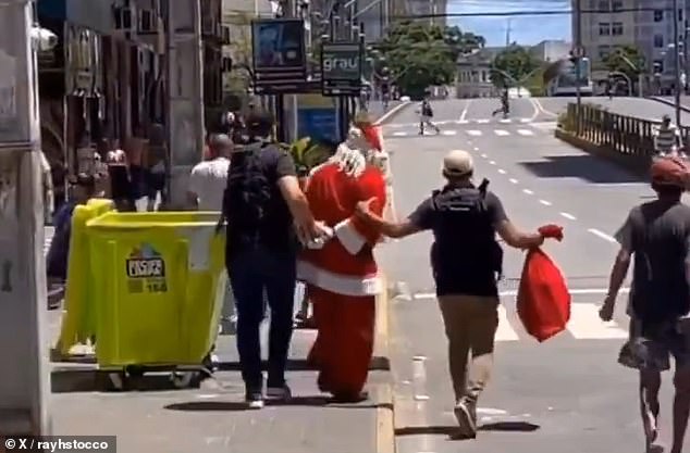 Influencers in Brazil captured the hilarious moment a man wearing a Santa outfit was arrested and taken to the city of Recife