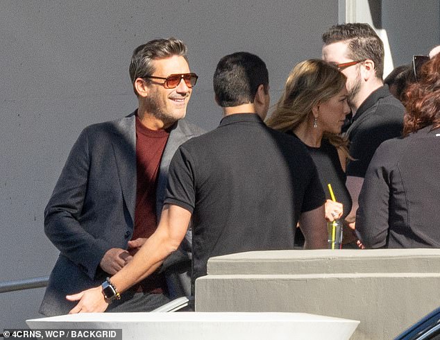 Jon Hamm looked dapper in a crisp gray blazer paired with a maroon shirt and cool sunglasses