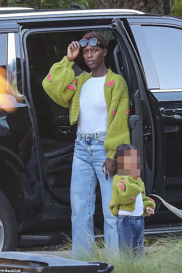 The mother-daughter duo rocked matching bright green knit cardigans with cute watermelon appliqués