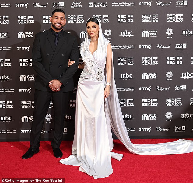 Former professional boxer Amir, 36, lovingly posed arm-in-arm with his glamorous wife Faryal as they stepped out at the glitzy event in Jeddah, Saudi Arabia