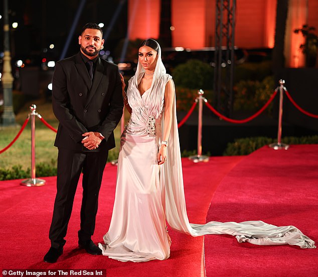 Amir, who was recently embroiled in several fraud scandals, looked dapper in an all-black suit as he walked the red carpet with his wife