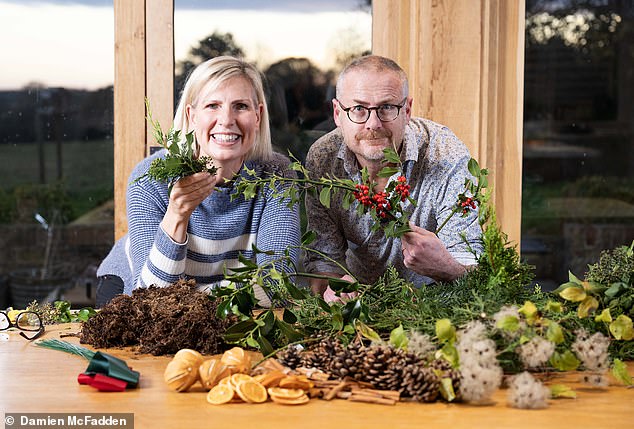 The finished wreath should easily last a month hung on an exterior door with a damp moss base, says Geraldine