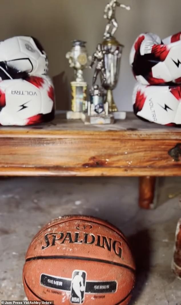 The explorer, whose name is Ashley Urbex, found apartments full of abandoned belongings, including this basketball and trophies