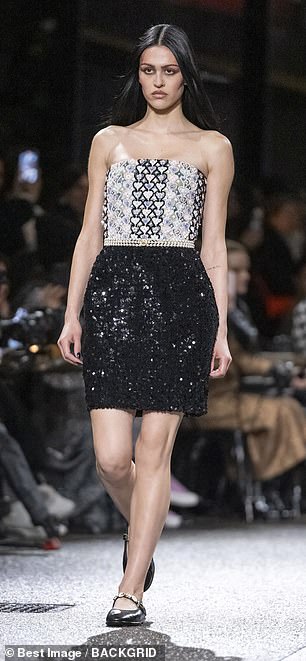 Some of the looks seen during the fashion show included a silver strapless top with a sparkling black skirt