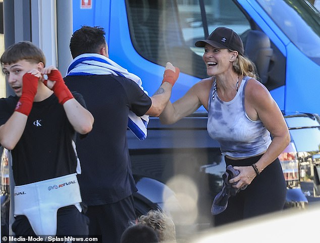 Ant got in some running, sit-ups and a bit of boxing, before putting a striped towel around his neck to soak up his sweat in the scorching heat