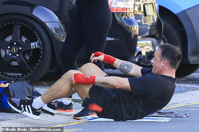 He lay on the floor of a parking garage performing sit-ups