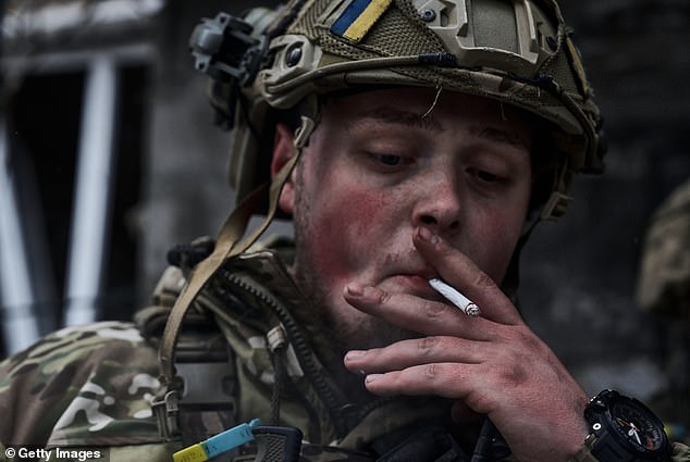 A Ukrainian soldier smokes during a break on December 7 in Avdiivka, Ukraine