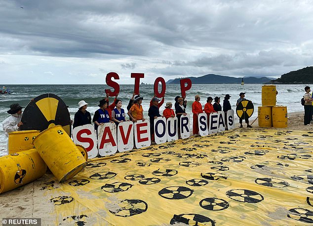 Activists take part in a protest against Japan releasing treated radioactive water from the destroyed Fukushima nuclear power plant in Busan, South Korea