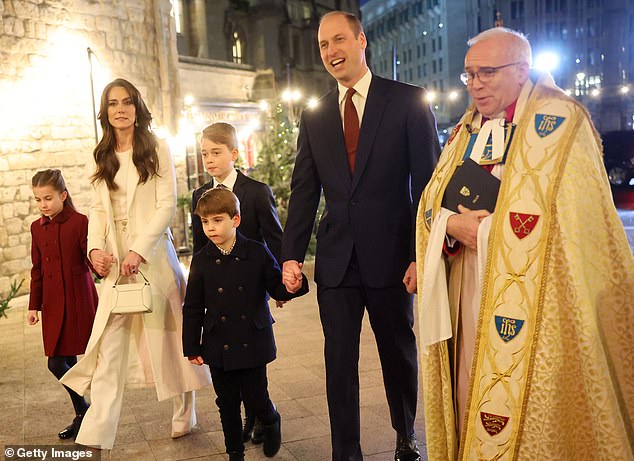 Prince Louis held his father's hand as they joined Kate, Charlotte, George and Reverend Dr.  David Hoyle walked into the Christmas carol concert