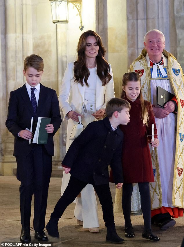 The Princess of Wales watches as Louis blows out Charlotte's candle