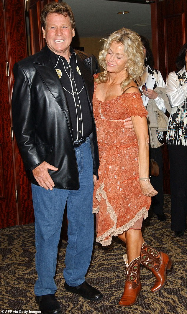 She reunited with Ryan in 2001 and continued acting into the 2000s, but her career was cut short by two brutal bouts of anal cancer;  they are pictured in 2004