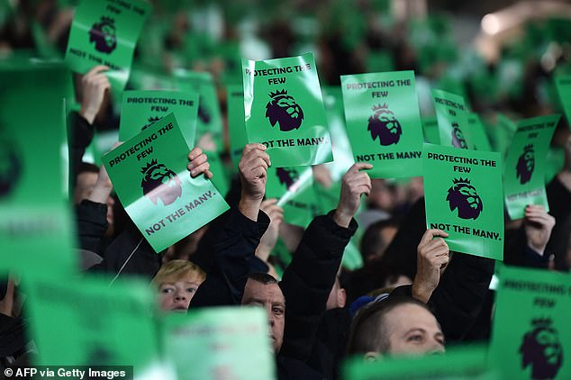 Everton fans were pictured holding green signs during their win over Newcastle