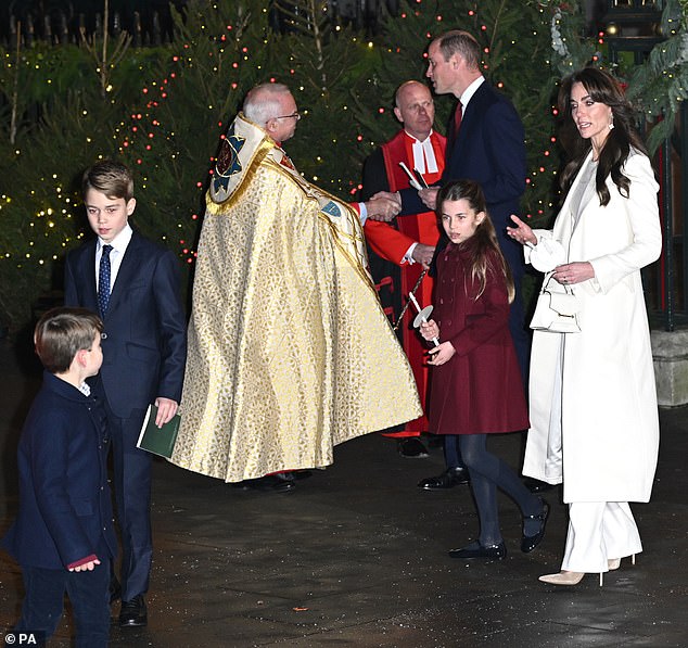 The Princess of Wales (right) appears to have a conversation with Prince Louis (left) after the service.