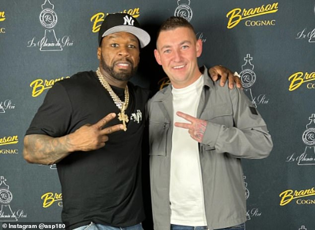 Nathan Aspinall (right) posed for a photo with rap legend 50 Cent (left) after watching his performance last month