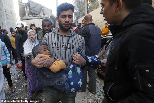 A child is rescued from the rubble in Gaza after an Israeli airstrike