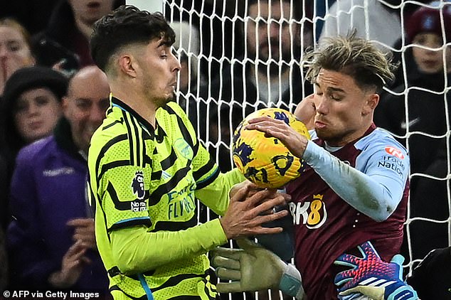 Arsenal's Kai Havertz (left) was adjudged to have handled the ball in the penalty area before scoring