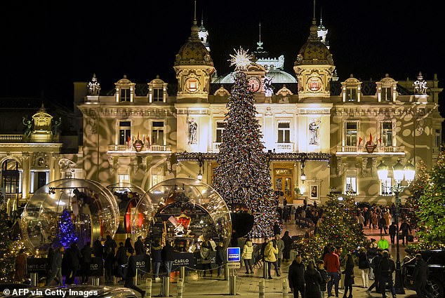 The royals attended an event where the Christmas lights were displayed in front of the Monte Carlo Casino (pictured on December 7)