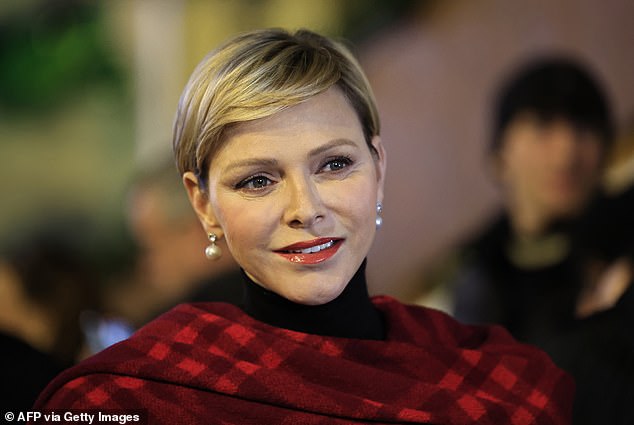 Charlene was the epitome of old-school Hollowood glamour, with her blonde pixie cut in a side part and a classic red lip.