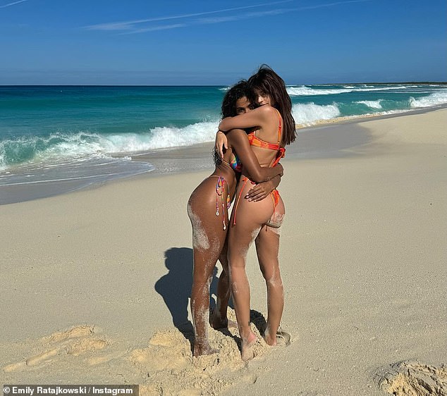 The mother-of-one rocked an orange floral string bikini and put on a breathtaking show as she frolicked in the tropical country's beautiful sand