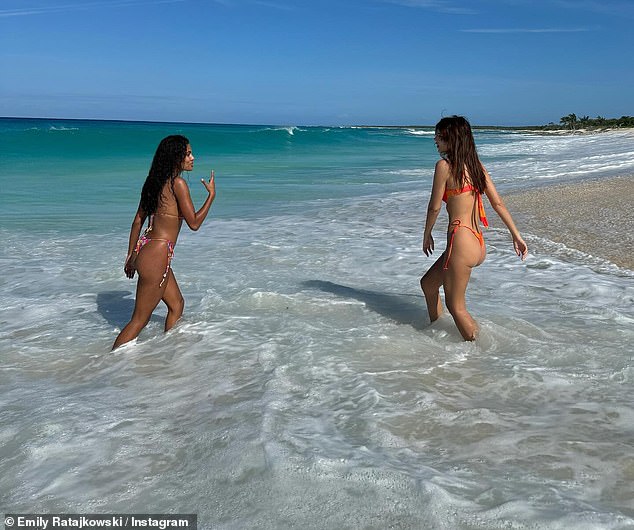 The gorgeous couple appeared in good spirits as they stopped to pose on the beach