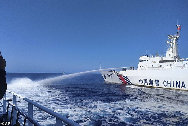 The Philippines on Saturday accused the Chinese coast guard of using water cannons to 