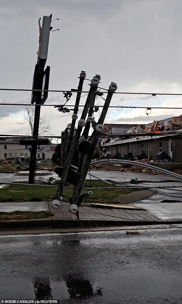 A downed light pole and damaged homes after a possible tornado near Clarksville