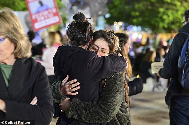 Two women embrace each other during the emotional demonstration in Tel Aviv, Israel on Saturday evening