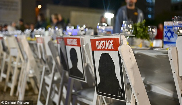 Empty dining table chairs were set up for the vigil, which was modeled after a Hanukkah celebration