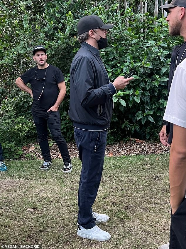 The 49-year-old actor wore a face mask and baseball cap as he attended Robert De Niro's Q&A during Art Basel with his 25-year-old girlfriend.  He also presented himself casually in a dark ensemble with a stylish bomber jacket, a classic T-shirt and comfortable trousers