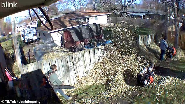 Armed with two backpack leaf blowers and one standalone leaf blower, he and two friends blow the piles of leaves back into the neighbor's yard.