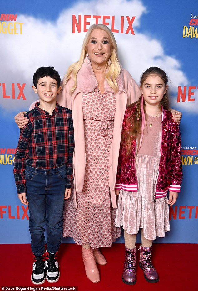 Meanwhile, Vanessa Feltz turned heads in a pink ensemble as she posed with her rarely seen grandchildren Zeke and Neroli