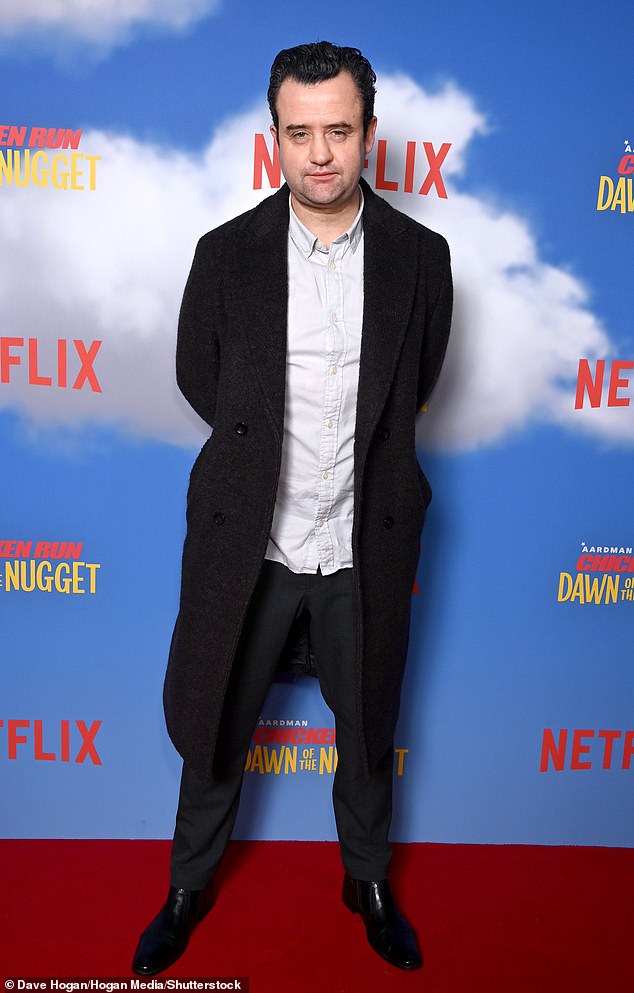 Elsewhere, actor Daniel Mays dressed smartly in a long black wool coat worn over a white open-collar shirt and black trousers.