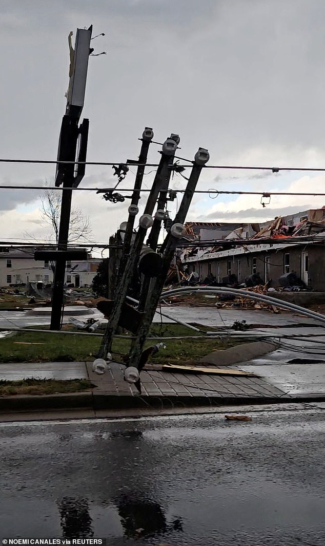 A downed light pole and damaged homes after a possible tornado near Clarksville