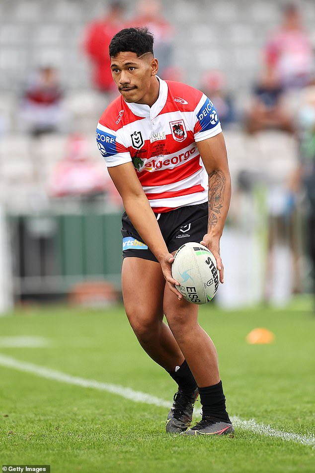 The St George Illawarra playmaker (pictured playing in 2021) brandished a hammer as he chased two traders onto the roof of a house