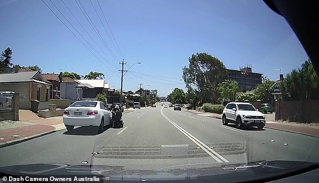 Moment of impact: The impact forced the scooter to move sideways, with the car hitting the older scooter's left wrist and shoulder