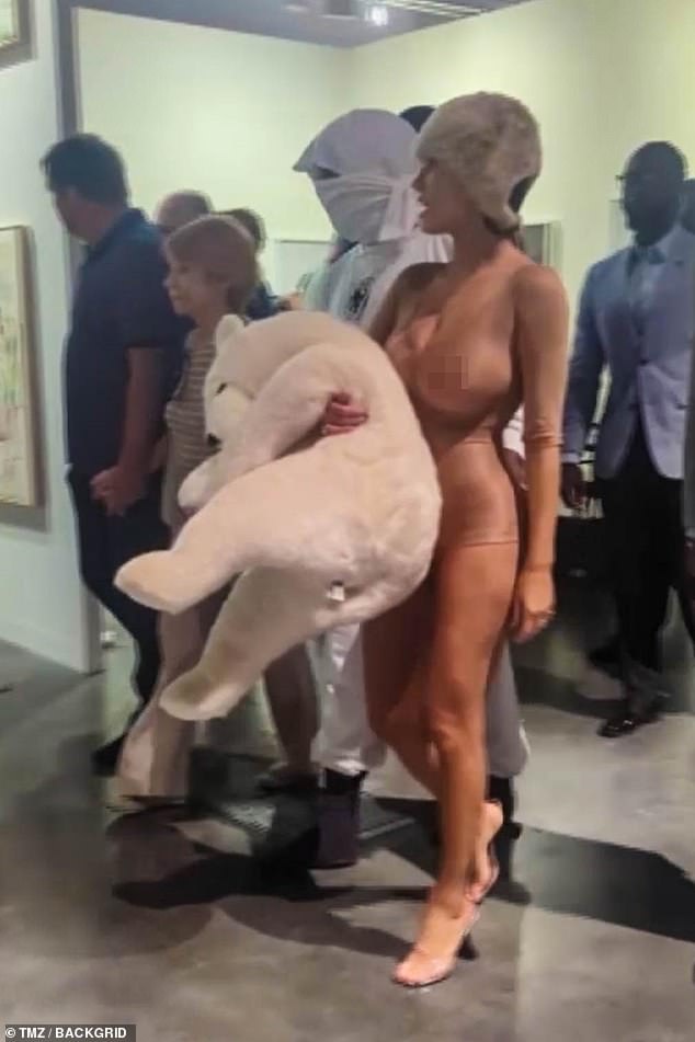 While the rapper, 46, wore an all-white outfit including a face mask, Bianca, 28, had all eyes on her in an X-rated outfit consisting of a sheer nude bodysuit.