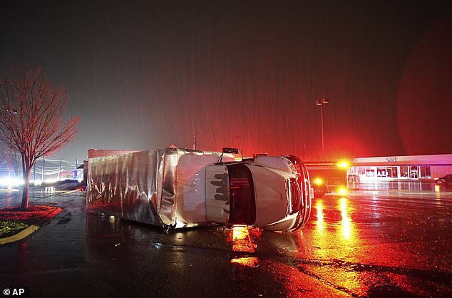 A semi-trailer is destroyed by an apparent tornado on West Main Street in Hendersonville