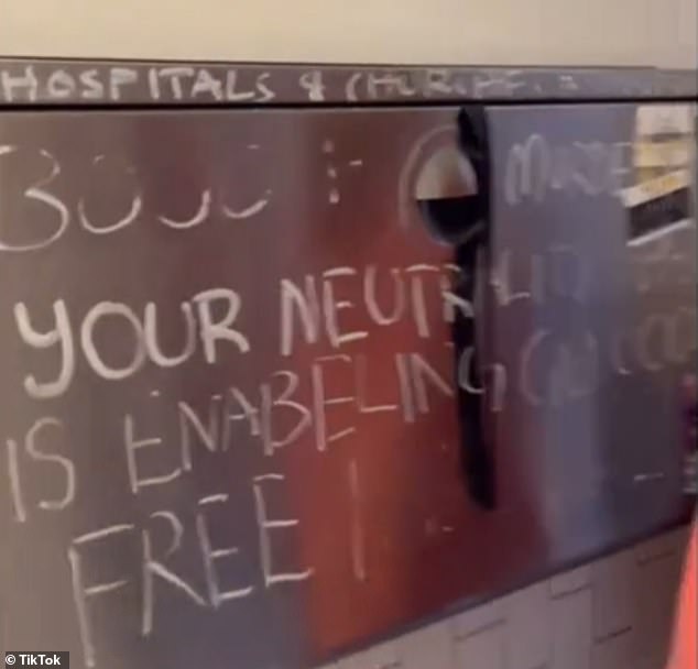 The woman had noticed the graffiti and complained to the staff, who then tried to prevent her from returning to take a photo