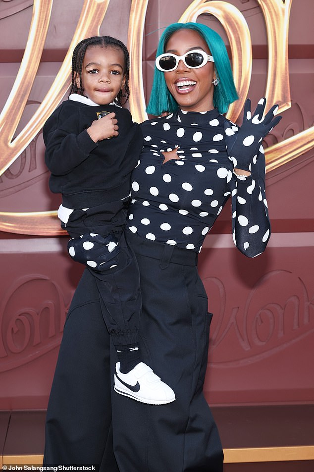 The singer and actress, 42, wore shoulder-length turquoise hair to match her dark blue and white polka dot top, matching gloves and trousers that flared from the knees.