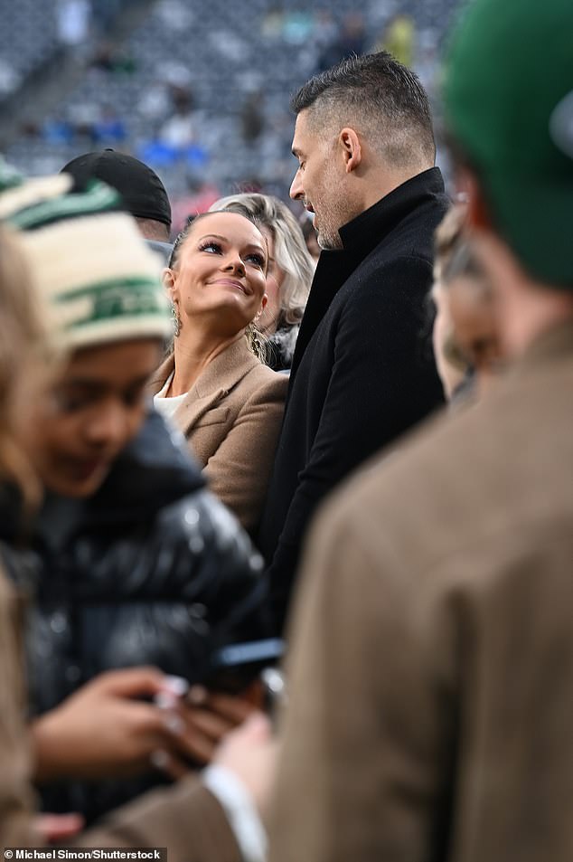 She looked up admiringly at her new friend, who is half a foot taller than her