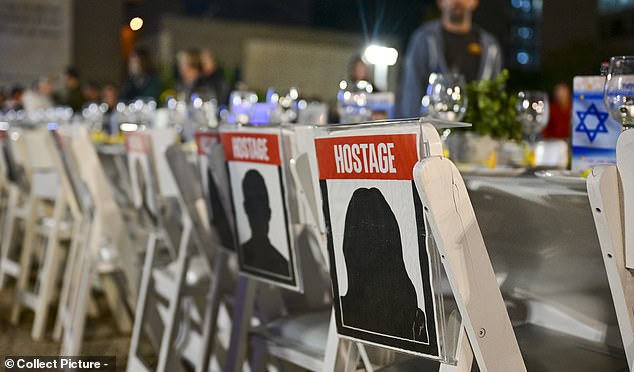 Empty dining table chairs were set up for the vigil, which was modeled after a Hanukkah celebration